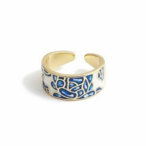 Gold-coloured ring with white enamel and blue pattern