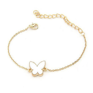 Gold tone bracelet with white enamel butterfly charm
