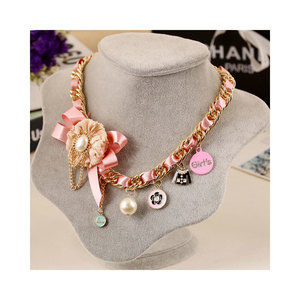 Pink bow gold tone necklace with pearl and charms